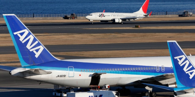 Jan. 30, 2013: All Nippon Airways passenger planes park on the tarmac of Haneda Airport in Tokyo.
