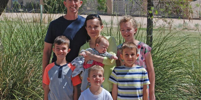 Col. Leland Bohannon, seen here with his family, was suspended from command over his views, according to his attorney.