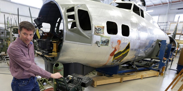 Feb. 20, 2014: Dave Shiffer displays a throttle quadrant that will be placed in the B-17 World War II-era bomber being built from salvaged and fabricated parts at the Champaign Aviation Museum in Urbana, Ohio.