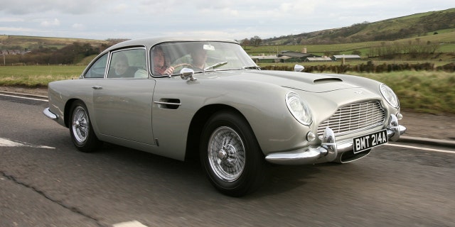 The Aston Martin DB5 driven by James Bond in GoldenEye is set to sell for £1.6 MILLION at auction.See story SWBOND.In the 1995 film, 007 - played by Pierce Brosnan - raced the classic British sports car around the Monaco hills in pursuit of Xenia Onatopp, the Ferrari-driving assassin played by Famke Janssen.It was Brosnanâs first appearance as the MI6 agent - and was the first time Bond drove an Aston Martin DB5 since the days of Sean Conneryâs playing the spy. After filming, the 1965 car was used by Eon Productions for promoting the Motion Picture GoldenEye and the retro styled DB7. The DB5 was bought by its current owner in 2001 - and they are now selling it at Bonhamsâ Festival of Speed sale in Goodwood on July 13. Bonhams has given it a guide price of £1.6 million.