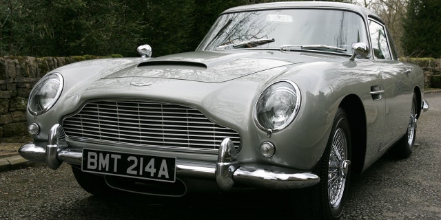 The Aston Martin DB5 driven by James Bond in GoldenEye is set to sell for £1.6 MILLION at auction.See story SWBOND.In the 1995 film, 007 - played by Pierce Brosnan - raced the classic British sports car around the Monaco hills in pursuit of Xenia Onatopp, the Ferrari-driving assassin played by Famke Janssen.It was Brosnanâs first appearance as the MI6 agent - and was the first time Bond drove an Aston Martin DB5 since the days of Sean Conneryâs playing the spy. After filming, the 1965 car was used by Eon Productions for promoting the Motion Picture GoldenEye and the retro styled DB7. The DB5 was bought by its current owner in 2001 - and they are now selling it at Bonhamsâ Festival of Speed sale in Goodwood on July 13. Bonhams has given it a guide price of £1.6 million.