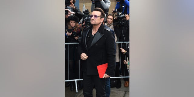 November 15, 2014. Singer Bono arrives at a music studio to record his segment of the new Band Aid 30 charity single in London.