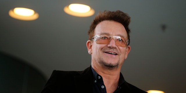 Bono, lead singer of the band U2 and ONE organisation co-founder arrives for a reception with German Chancellor Angela Merkel and with youth representatives of the organisation ONE against human poverty in Berlin April 8, 2013.