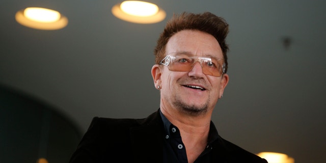 Bono, lead singer of the band U2 and ONE organisation co-founder arrives for a reception with German Chancellor Angela Merkel and with youth representatives of the organisation ONE against human poverty in Berlin April 8, 2013.