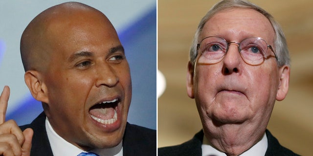 Sen. Cory Booker, D-N.J., left, remained hopeful Wednesday that Senate Majority Leader Mitch McConnell, R-Ky., would bring to the Senate floor legislation designed to protect Special Counsel Robert Mueller from being fired.