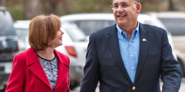 Sen. John Boozman walks with his wife, Cathy Boozman. (AP File Photo/Beth Hall)
