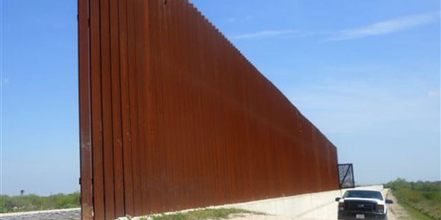 March 15, 2014: This photo shows a border patrol vehicle patrolling along the Abram border fence in Abram, Texas. (AP)