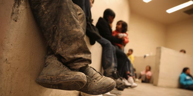 Women and children sit in a holding cell at a U.S. Border Patrol processing center after being detained by agents near the U.S.-Mexico border on Sept. 8, 2014, near McAllen, Texas. Thousands of immigrants, many of them families and unaccompanied minors, continue to cross illegally into the United States, although the numbers are down from a springtime high. Texas' Rio Grande Valley area is the busiest sector for illegal border crossings into the United States. 