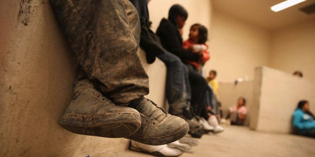 Women and children sit in a holding cell at a U.S. Border Patrol processing center after being detained by agents near the U.S.-Mexico border on Sept. 8, 2014, near McAllen, Texas. Thousands of immigrants, many of them families and unaccompanied minors, continue to cross illegally into the United States, although the numbers are down from a springtime high. Texas' Rio Grande Valley area is the busiest sector for illegal border crossings into the United States.