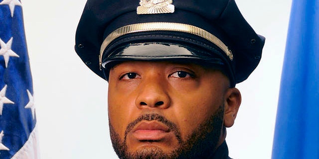 This undated official portrait released by the Boston Police Department shows policer officer Dennis Simmonds, who died on April 10, 2014.
