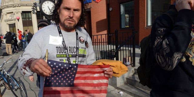 BOSTON, MA - APRIL 15:  Carlos Arredondo, who was at the finish line of the 117th Boston Marathon when two explosives detonated, leaves the scene on April 15, 2013 in Boston, Massachusetts. Two people are confirmed dead and at least 28 injured after at least two explosions went off near the finish line to the marathon.  (Photo by Darren McCollester/Getty Images)