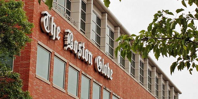 A man was arrested after threatening employees at the Boston Globe several times after the newspaper published an editorial against President Trump's attacks on the media, officials said.