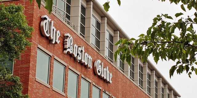 A man was arrested after threatening employees at the Boston Globe several times after the newspaper published an editorial against President Trump's attacks on the media, officials said.