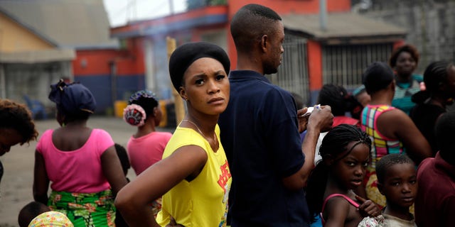 Residents of the Kisenso district of Kinshasa, Congo, line up to receive yellow fever vaccines on Thursday, July 21, 2016. Some experts say about 40 million vaccines are needed to extinguish the outbreak _ enough to immunize everyone in Angola and Kinshasa. To date, the World Health Organization and partners say they have shipped more than 18 million doses of yellow fever vaccine for emergency campaigns. They are 22 million doses short. (AP Photo/Jerome Delay)