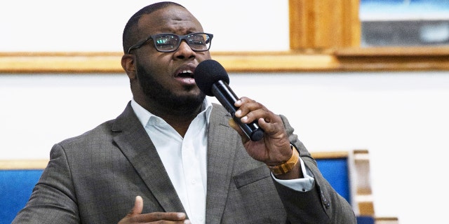 This Sept. 21, 2017, photo provided by Harding University in Search, Ark., shows Botham Jean leading worship at a university presidential reception in Dallas.