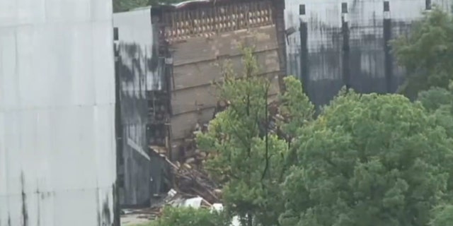 Damage can be seen after a collapsed distillery warehouse poisoned creeks for nearby fish.