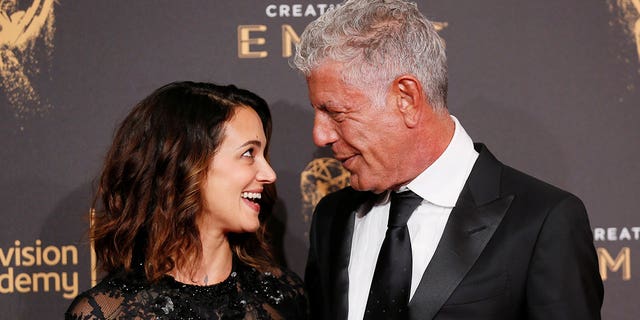 Anthony Bourdain (right) has defended his girlfriend, Asia Argento, over her claims that Harvey Weinstein sexually assaulted her.