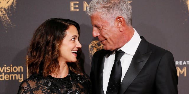 Anthony Bourdain (right) has defended his girlfriend, Asia Argento, over her claims that Harvey Weinstein sexually assaulted her.