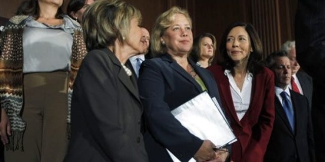 Sen. Mary Landrieu, D-La., accompanied by Sen. Barbara Boxer, D-Calif., and Sen. Maria Cantwell, D-Wash., at a news conference in Washington, Sept. 14, 2010.