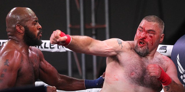 DJ Linderman, right, fights Arnold Adams.