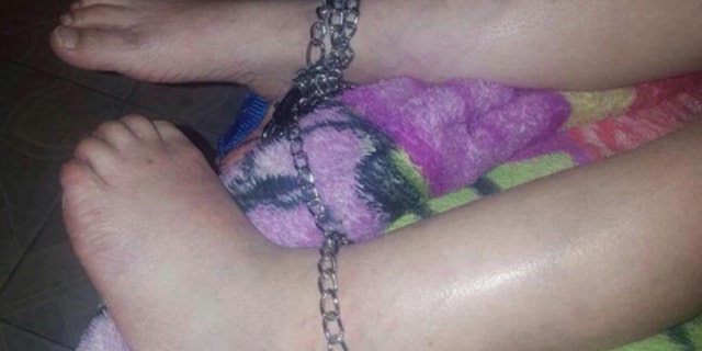 The 5-year-old boy was found with chains on his ankles.