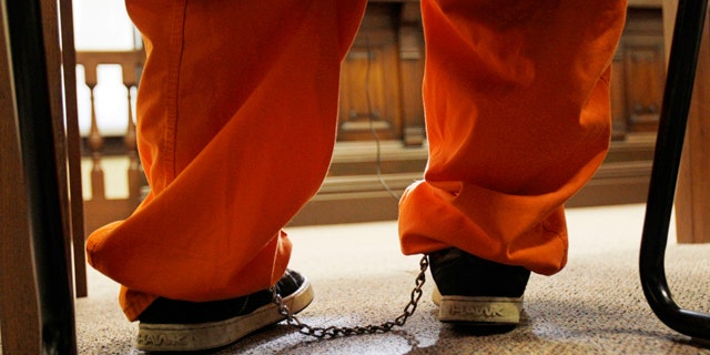 Jan. 3: A 10-year old boy sits with leg irons in a courtroom during his court appearance in Millersburg, Ohio. The boy has been charged as a juvenile with murder in the fatal shooting of his mother after authorities said he told a neighbor about the killing. (AP)