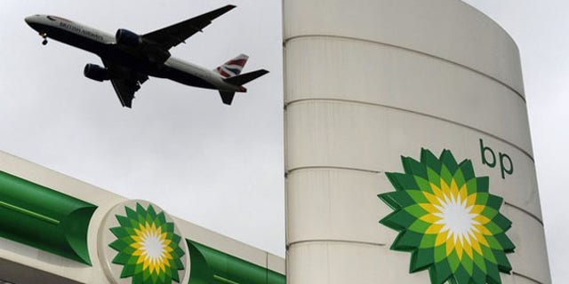 A plane flies over a British Petroleum gas station at Heathrow in London Feb. 2. (Reuters Photo)