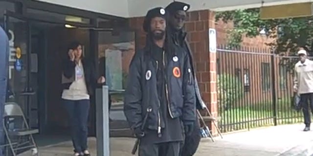 Members of the New Black Panther Party are seen outside a Philadelphia polling station in 2008. (YouTube)