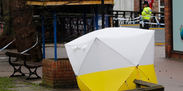 A police tent covers the the spot where former Russian double agent Sergei Skripal and his daughter Yulia were found critically ill following exposure to a "nerve agent substance" in Salisbury, England, Monday, March 12, 2018. (AP Photo/Frank Augstein)