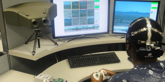 A brainwave-reading cap and a prototype binocular system combine to monitor threats far more effectively than a human acting alone.