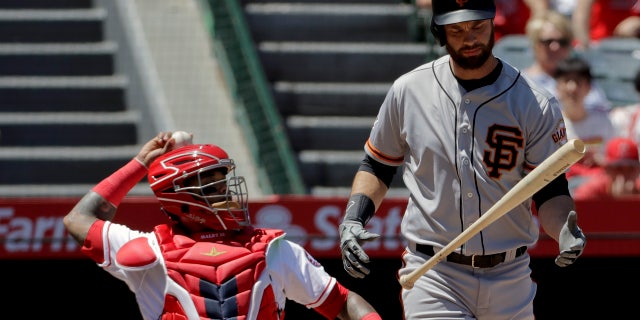 Brandon Belt reacts after hitting a foul ball during his 21-pitch first-inning at-bat Sunday afternoon.