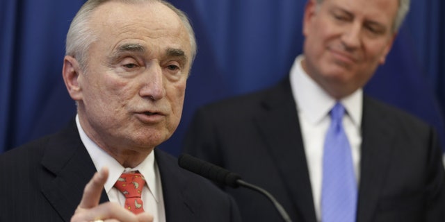 FILE - In this Dec. 5, 2013 file photo, William Bratton, left, speaks while New York Mayor-elect Bill de Blasio looks on during a news conference in New York introducing Bratton as de Blasio's choice for New York City police commissioner. Although Bratton is a proponent of the police tactic known as stop and frisk, which de Blasio says was used too much during the Bloomberg years, both men have pledged to better explain the use of the tactic and de Blasio has vowed to drop the Bloomberg administrations objections to a pair of watchdogs - both an independent general and a federal monitor - who have been tasked with overseeing the NYPD. (AP Photo/Seth Wenig, File)