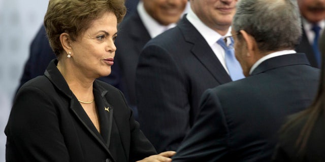 Apr. 11, 2015: Brazil's President Dilma Rousseff greets Cuba's President Raul Castro as they arrive for the oficial group photo of the VII Summit of the Americas in Panama City, Panama. (AP)