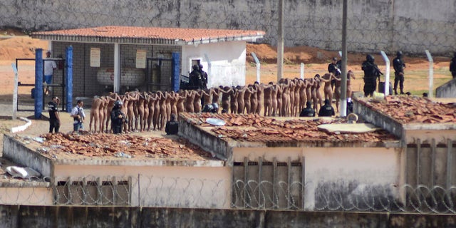 Jan. 15, 2017: Naked inmates stand in line while surrounded by police after a riot at the Alcacuz prison in Nisia Floresta, Rio Grande do Norte state, Brazi.