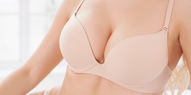Close-up of perfect female breasts in bra