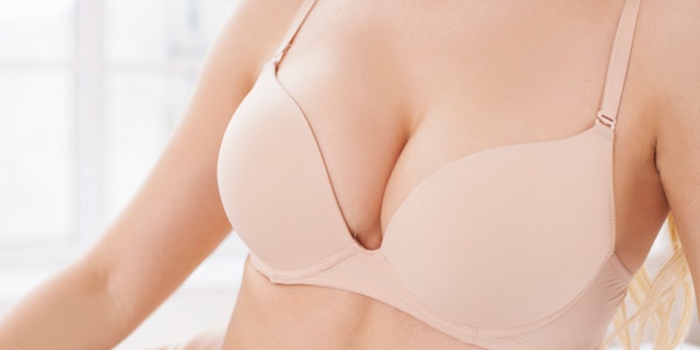 Close-up of perfect female breasts in bra