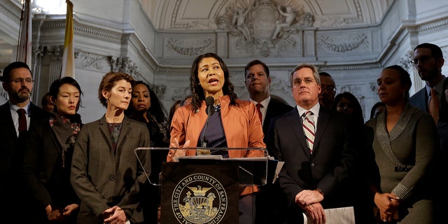 San Francisco Acting Mayor London Breed, center, speaks at a news conference at City Hall in San Francisco, Dec. 12, 2017. 