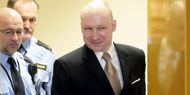 March 15, 2016: Mass killer Anders Behring Breivik is escorted by prison guards as he enters the court room in Skien prison. He recently filed a claim that his human rights were violated by being in solitary confinement. (Reuters)