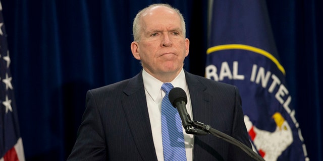 Dec. 11, 2014: CIA Director John Brennan pauses during a news conference at CIA headquarters in Langley, Va.