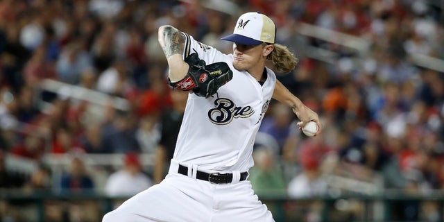 Milwaukee Brewers reliever Josh Hader on Saturday was greeted with a standing ovation by his fans as he emerged for the first time since his homophobic and racist tweets from seven years ago were revealed last week.