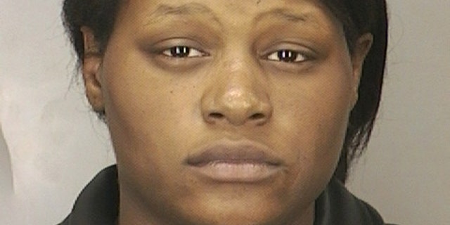 Leatrice Brewer is seen in this 2003 arrest photo provided by the Nassau County Police Department. A judge is holding a hearing Wednesday Nov. 6, 2013 to determine whether a Long Island mother found not guilty because of mental disease in the 2008 drowning of her three children deserves a piece of their $350,000 estate. (AP/Nassau County Police Department)