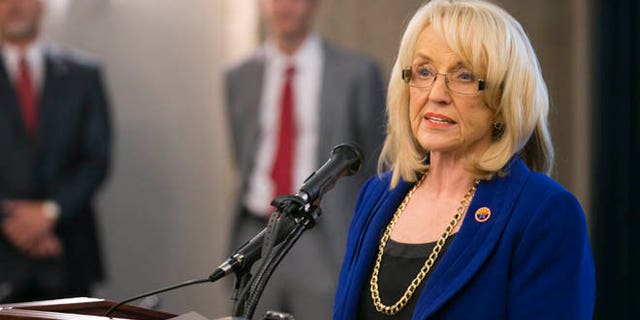 May 22, 2014: Arizona Gov. Jan Brewer speaks during a press briefing in Phoenix.