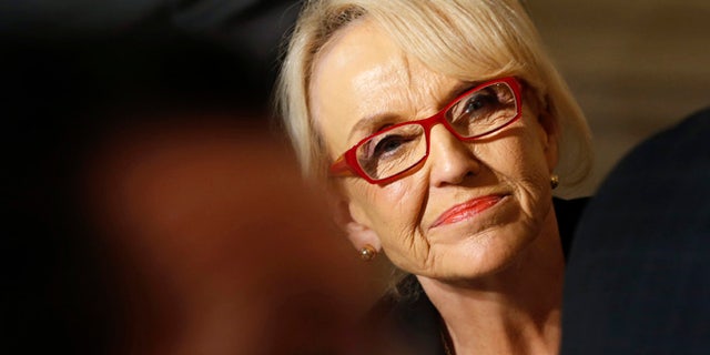 Feb. 24, 2014: Arizona Governor Jan Brewer looks up as President Obama addresses the National Governors Association in the State Dining Room of the White House in Washington. (Reuters)