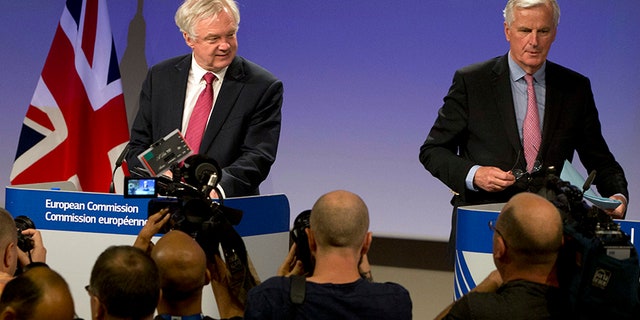 June 19, 2017: EU Chief Brexit Negotiator Michel Barnier, right, and British Secretary of State for Exiting the EU David Davis arrive for a media conference at EU headquarters in Brussels.