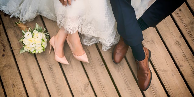 feet of bride and groom, wedding shoes (soft focus). Cross processed image for vintage lookfeet of bride and groom, wedding shoes (soft focus). Cross processed image for vintage look