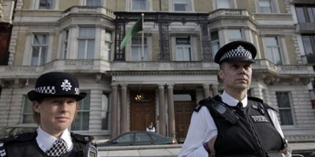 May 1: British police officers guard Libya's embassy in London