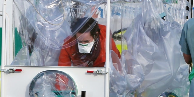 Ebola nurse Pauline Cafferkey being transported to a military aircraft in Scotland before being flown to London.