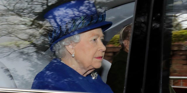 Britain's Queen Elizabeth II in a car with Prince Philip, arrives to attend the morning church service at St Mary Magdalene Church in Sandringham, England, Sunday Jan. 8, 2017. The 90-year-old British monarch was applauded by well-wishers as she arrived by car at St. Mary Magdalene Church in eastern England. It was her first public appearance in several weeks. (Chris Radburn/PA via AP)