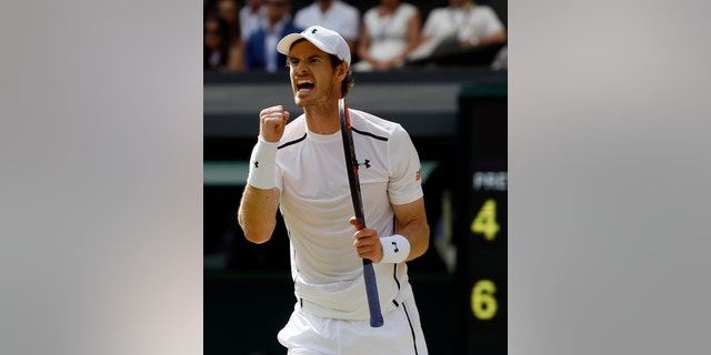 Andy Murray celebrates winning the second set against Milos Raonic.