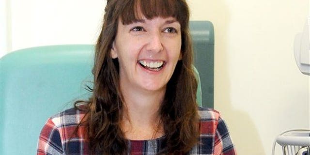 In this Saturday, Jan. 1, 2015 file photo, Pauline Cafferkey, a nurse who contracted Ebola while working in Sierra Leone, smiles in the Royal Free Hospital in London. (Lisa Ferguson/Scotland on Sunday/PA via AP)